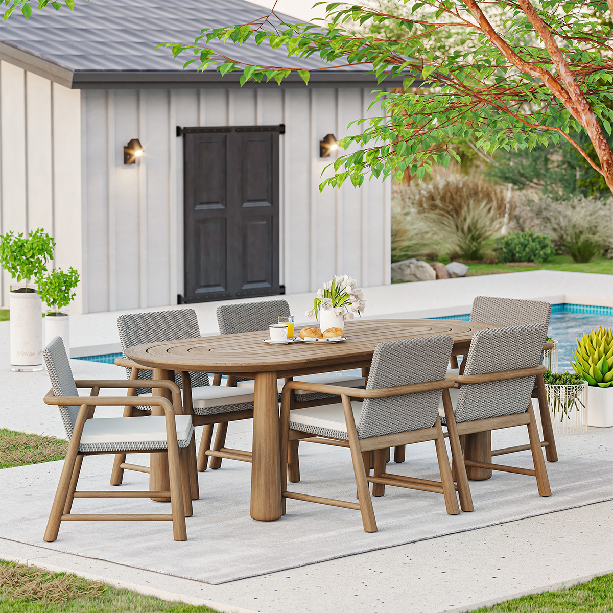 Collier Teak Outdoor Oval Dining Table with Rattan Armchair Set